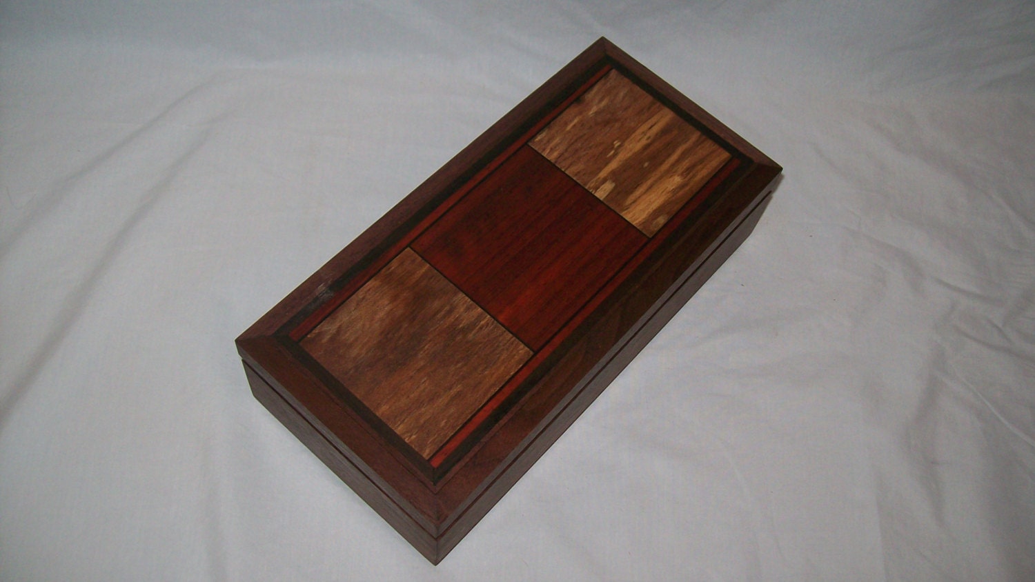 Handcrafted works of Art with a functional flair. Wooden trinket or keepsake box.9''x4 1/2''x2 3/4''