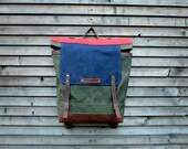 Waxed canvas backpack / rucksack with folded top and waxed leather shoulderstrap and bottom