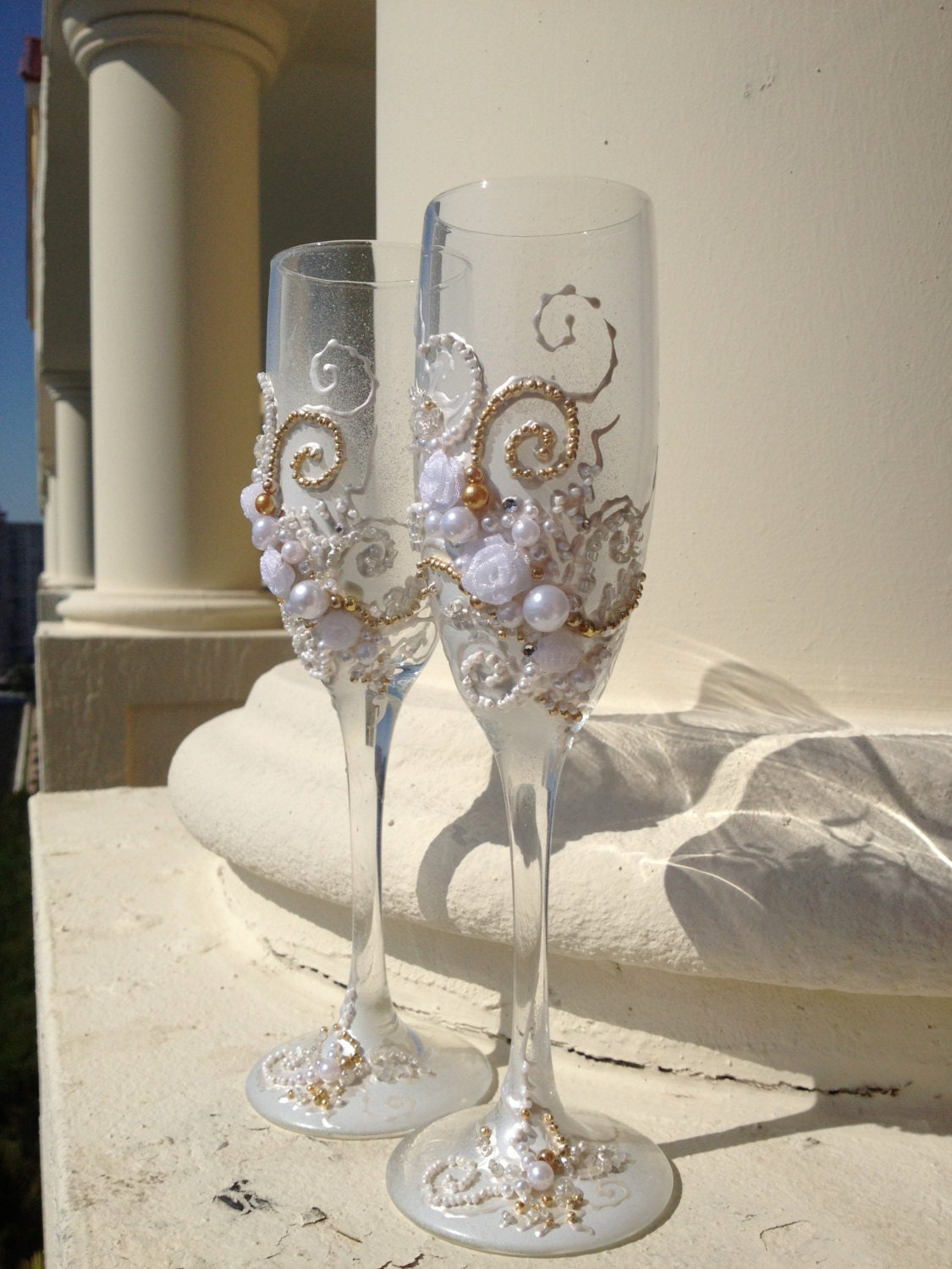 Wedding toasting glasses, hand decorated with an original design in white and gold
