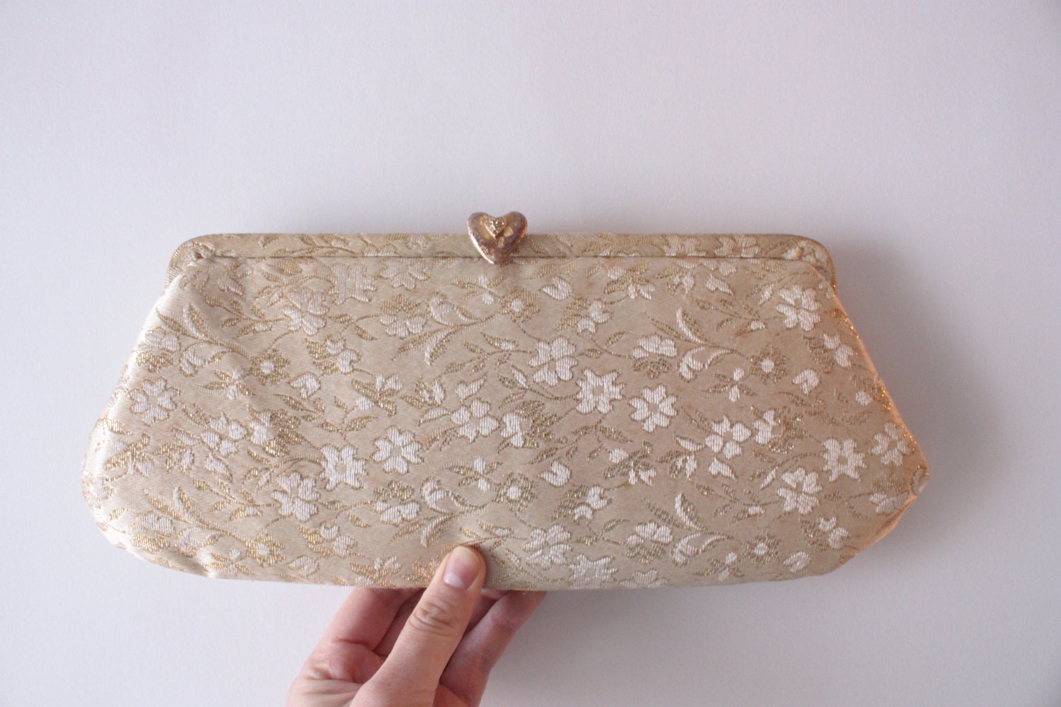 Vintage gold and cream brocade clutch with heart clasp