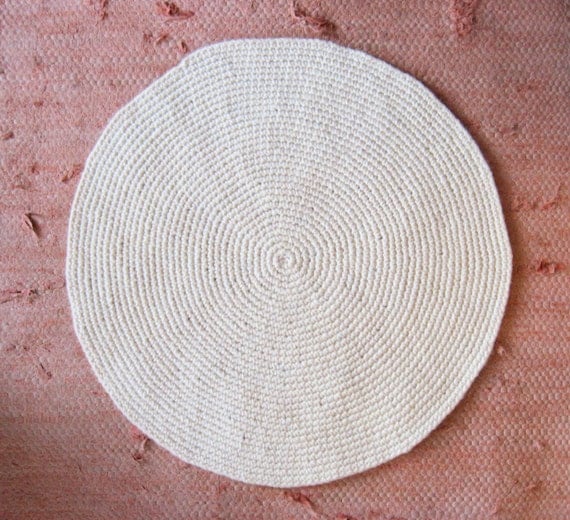 small off-white round wool rug mat
