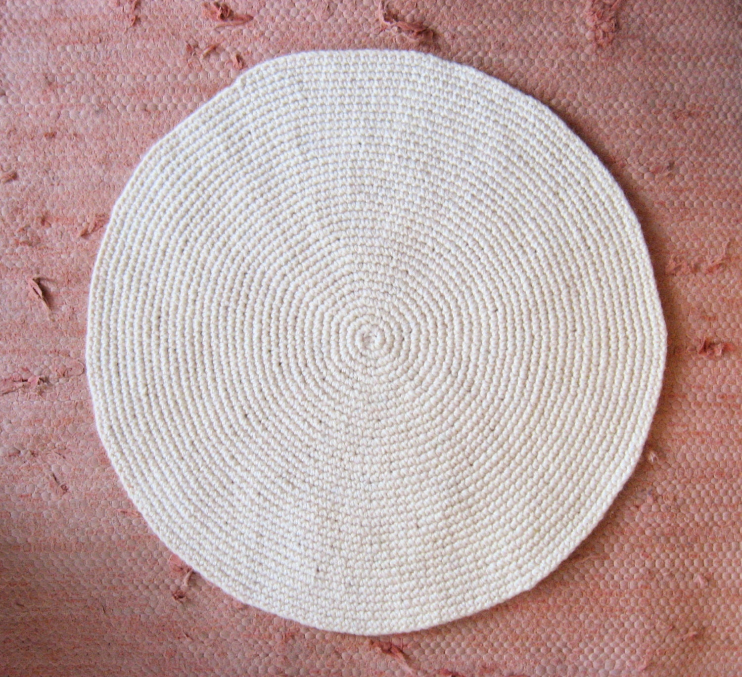 small off-white round wool rug mat