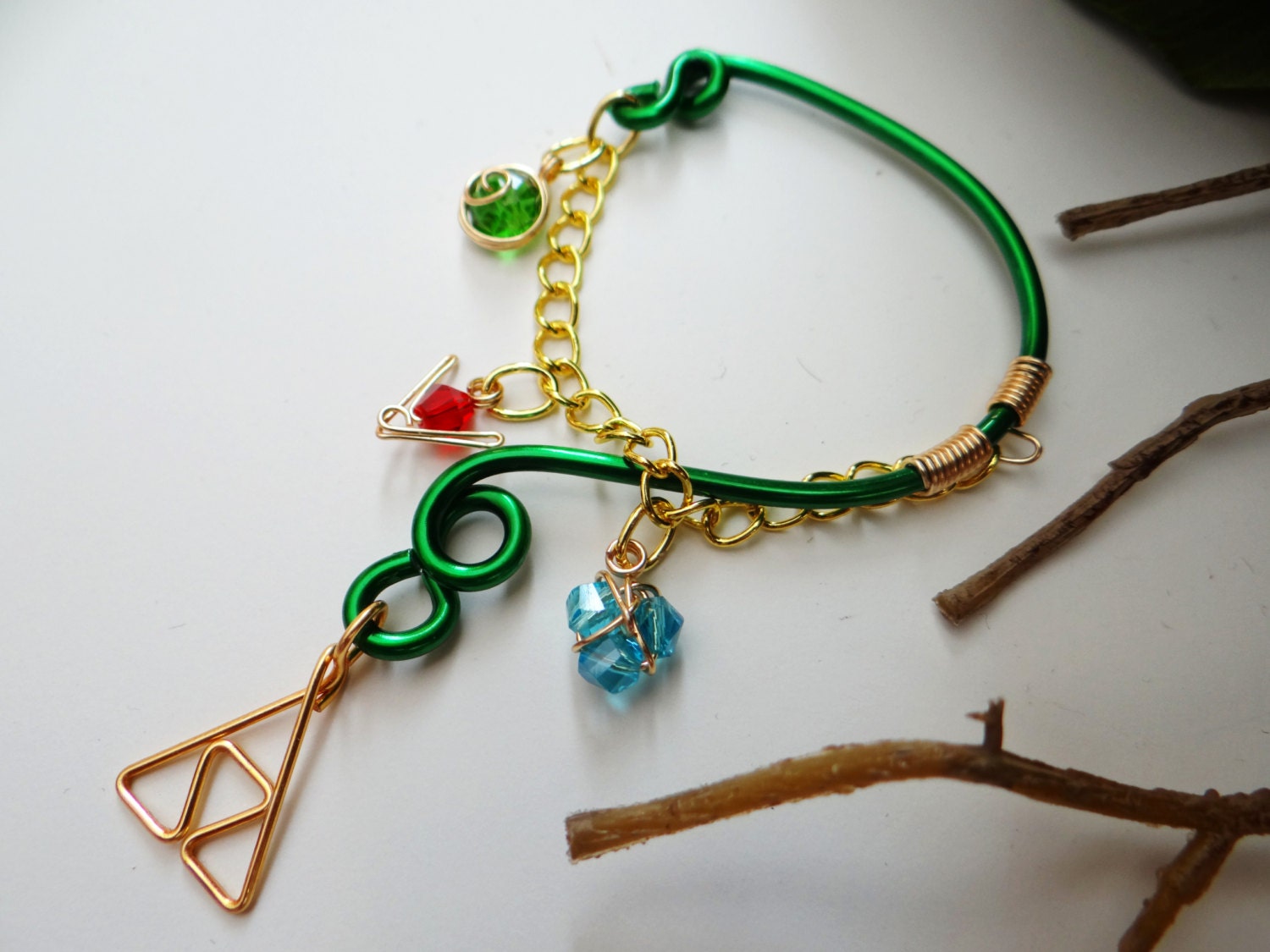 The Legend of Zelda's Wise Ear Bend with Hanging Spiritual Stones and Triforce