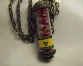 Bio Hazzard Tube Pendant Necklace Bronze