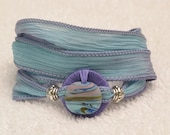 Silk Ribbon Whirly Wrap Bracelet in Sky Blue with a ceramic abstract accent piece Karen Blixen Museum