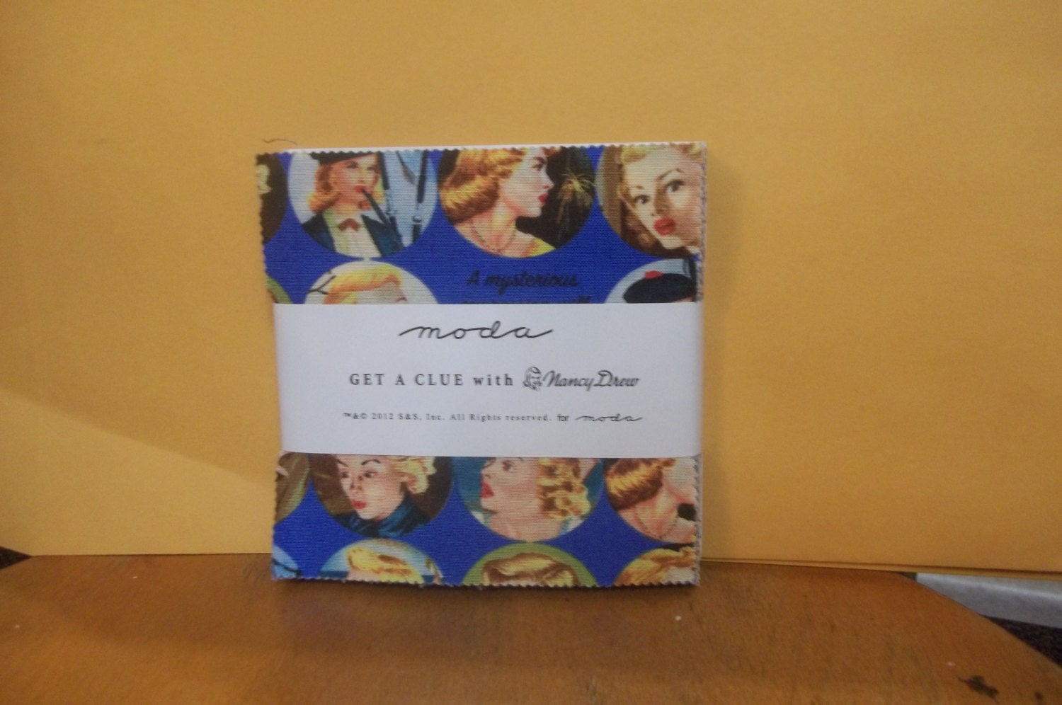 Get a Clue with Nancy Drew Charm Pack  By Moda 42, 5 inch squares all coordinate from the collection 1 charm pack