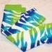 Baby Leg Warmers: Zebra Stripes of Turquoise, Lime Green, Blue, and White with Green Ruffle Trim