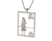 Sterling Silver pendant of a lovely lady on her way ith her Coat and suitcase.