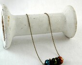 ON SALE handmade beads and brass/bronze necklace, metal spike wheel, blue, green and copper