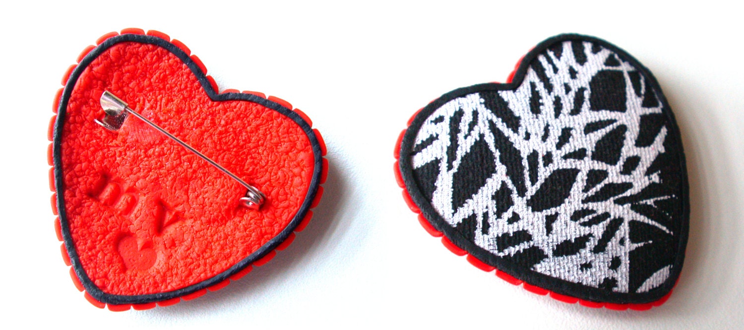 Black and white polymer heart brooch.