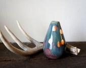 multi colored vase with copper dots