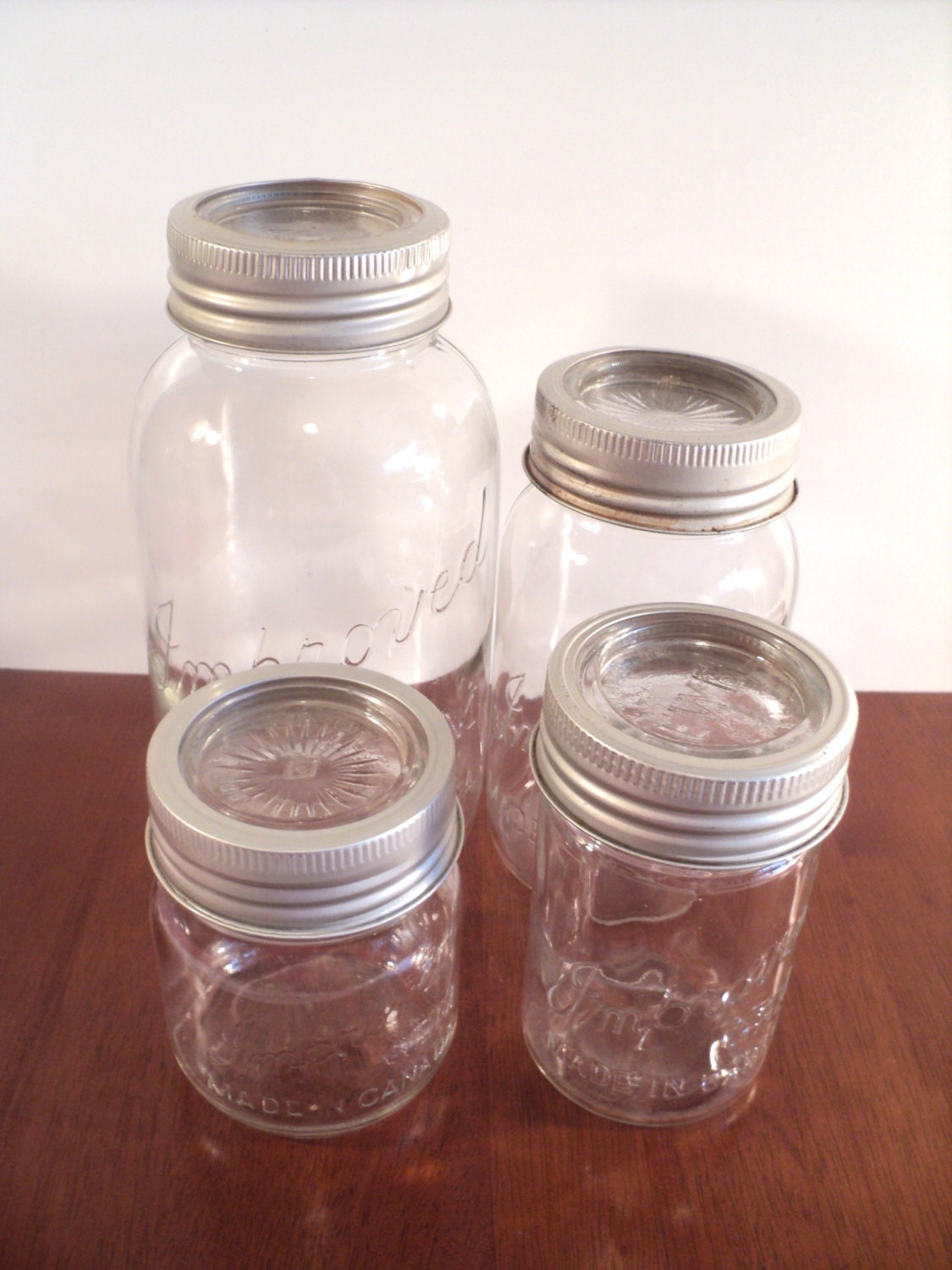 Mason Jar Set of 4, Half Gallon, Quart and 2 different sized pints, light pewter metal rings, glass tops GEM