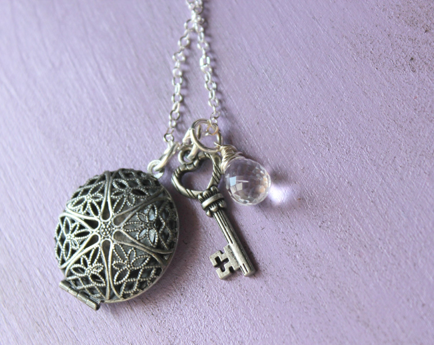 Antiqued locket charm necklace