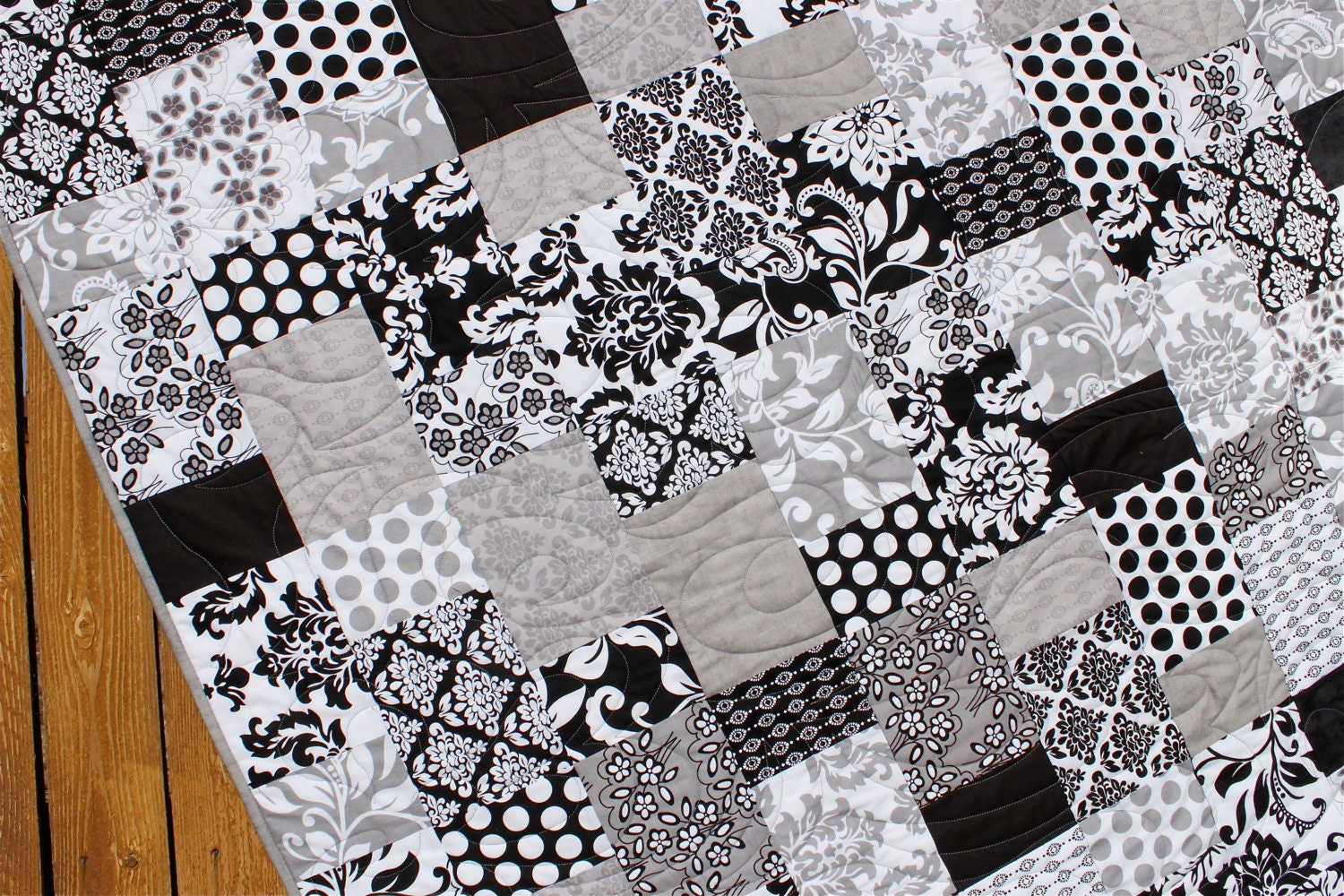 this-quilt-is-very-vibrant-and-makes-a-great-accent-for-the-room-black-grey-and-white-in-a