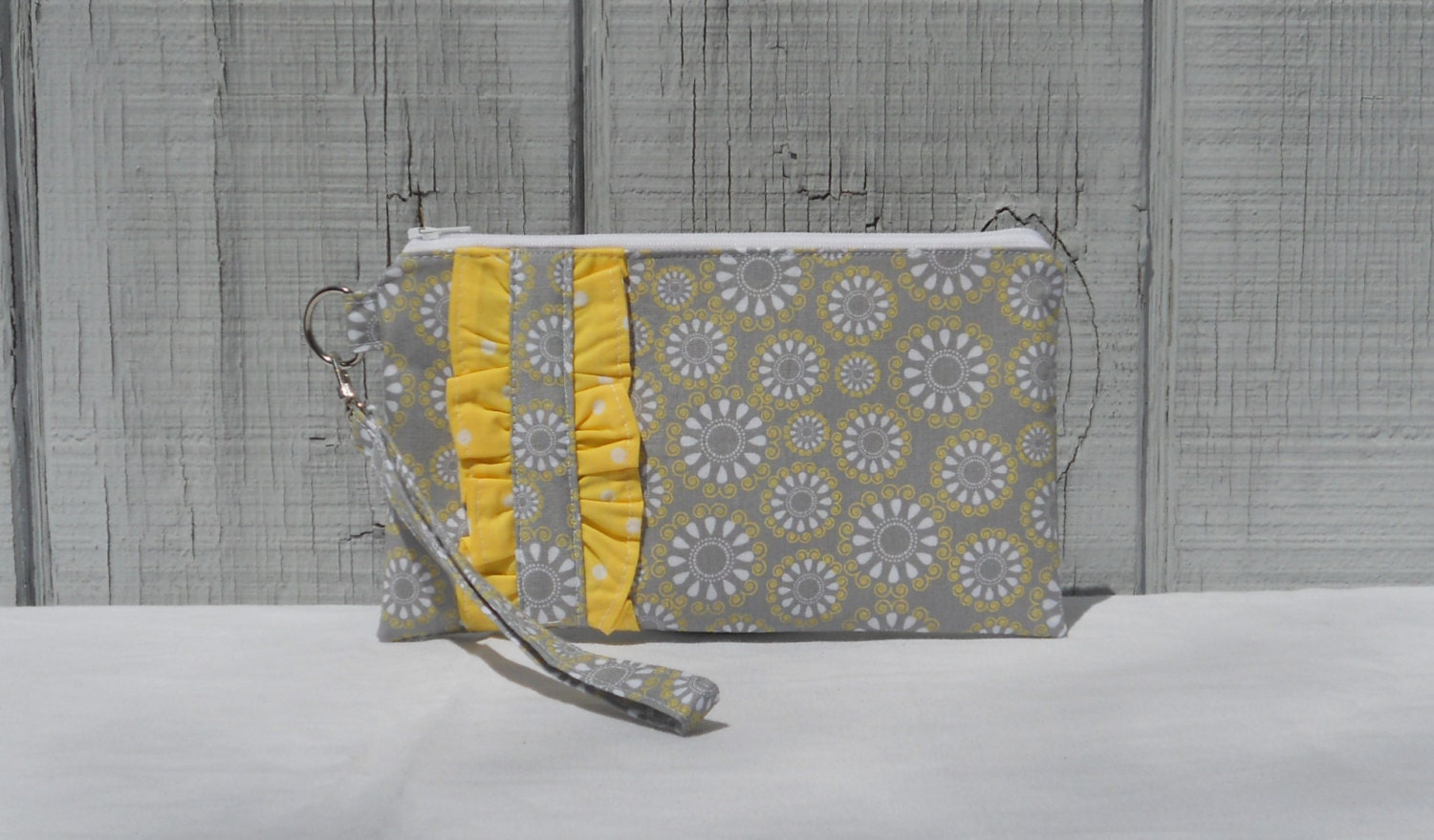 Clutch wristlet with ruffle accent, gray and yellow