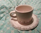 Hand-painted altered cup and saucer