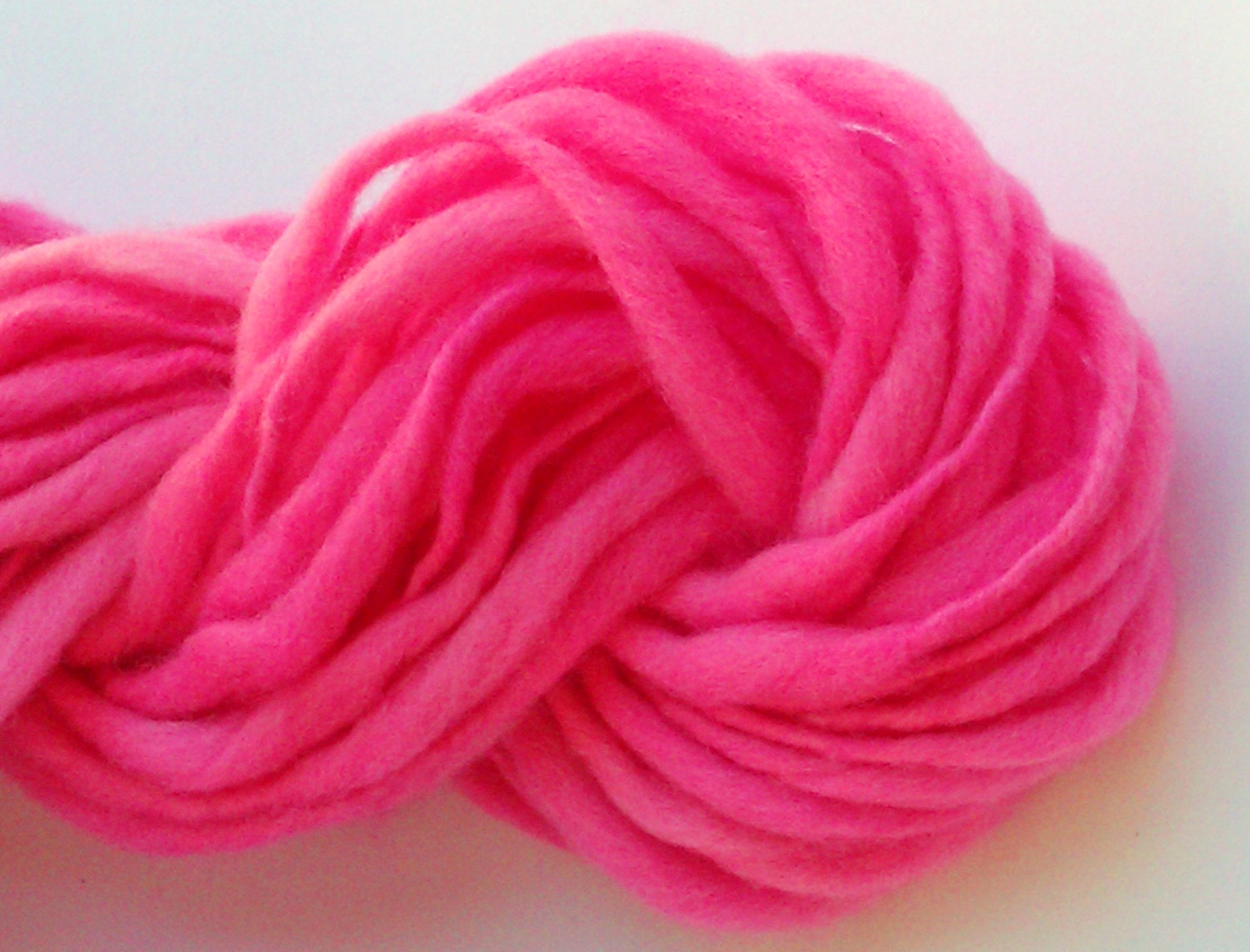 Pretty pink - Hand spun yarn, hand dyed slub. Thick and thin. Pure Australian 21 micron merino wool.