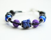Stylish handmade bracelet in black, blue and violet with pandora style beads