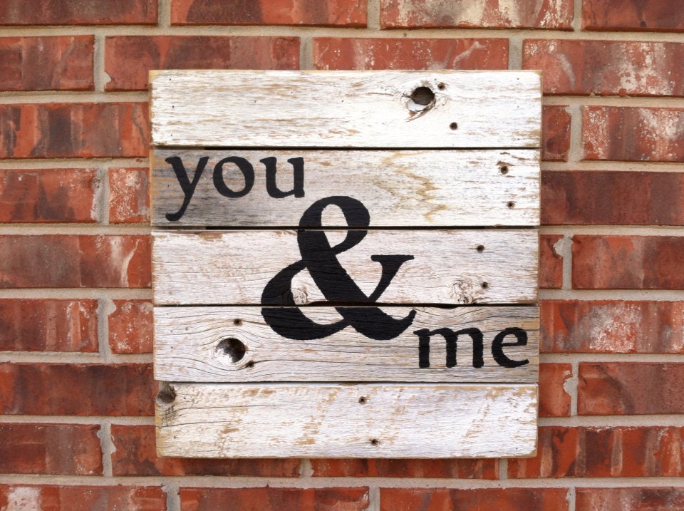 You & Me sign in black paint on a rustic white cedar fence picket canvas