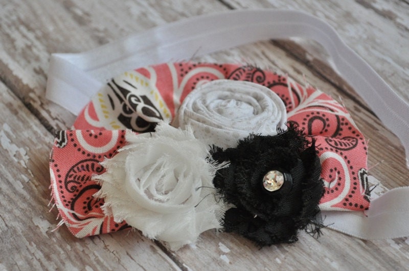 Cora. Black and white shabby flower, with grey dot rosette on salmon colored printed ruffle headband