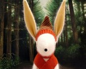 White Woollen Rabbit - Handmade plush sculpture - white woollen body with felt ears, wearing woollen pants with braces and matching hat.