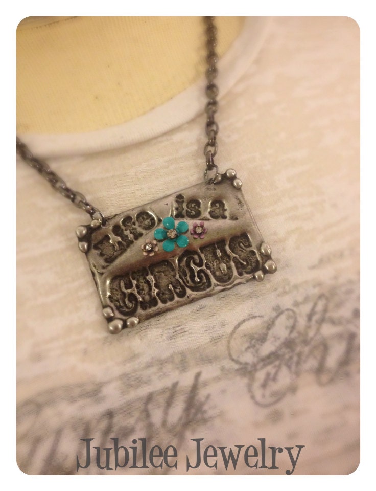 Life is a Circus molten soldered pendant necklace.