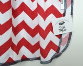 Chevron swaddling blanket. Red and white with navy edging.  Blanket size: Size 31 by 40 inches.  (Made by lippybrand)