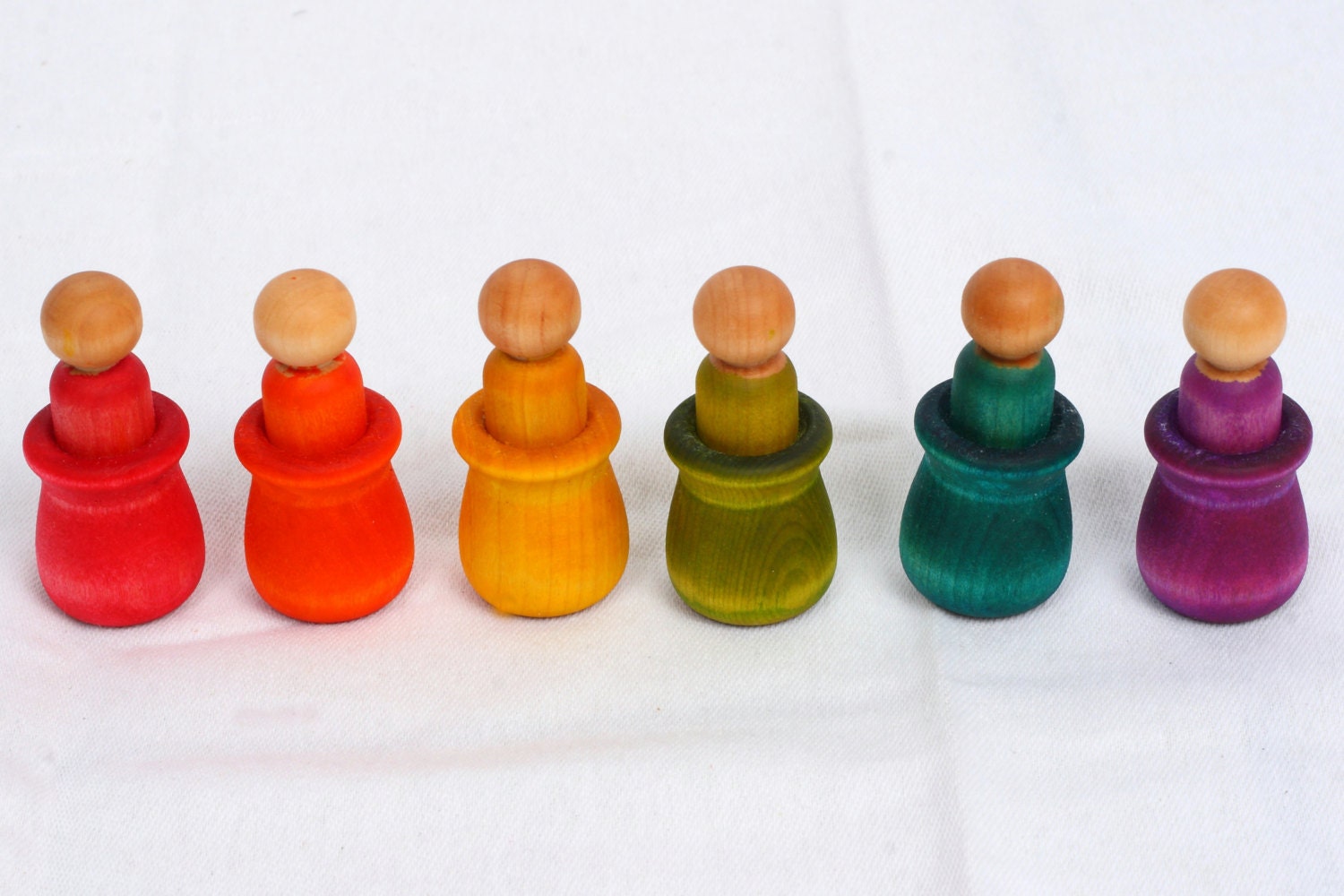 Montessori inspired matching game with peg dolls and cups