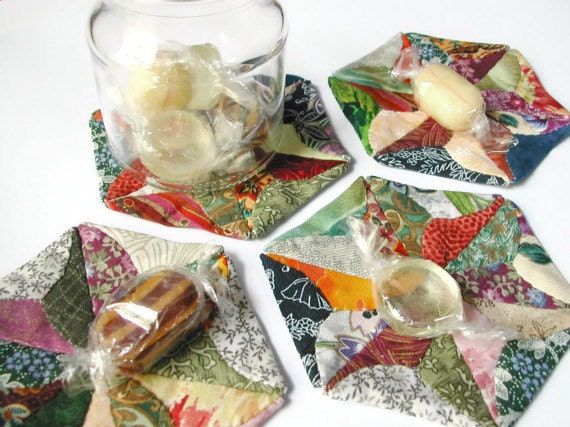 A set of four double sided origami-patchwork coasters