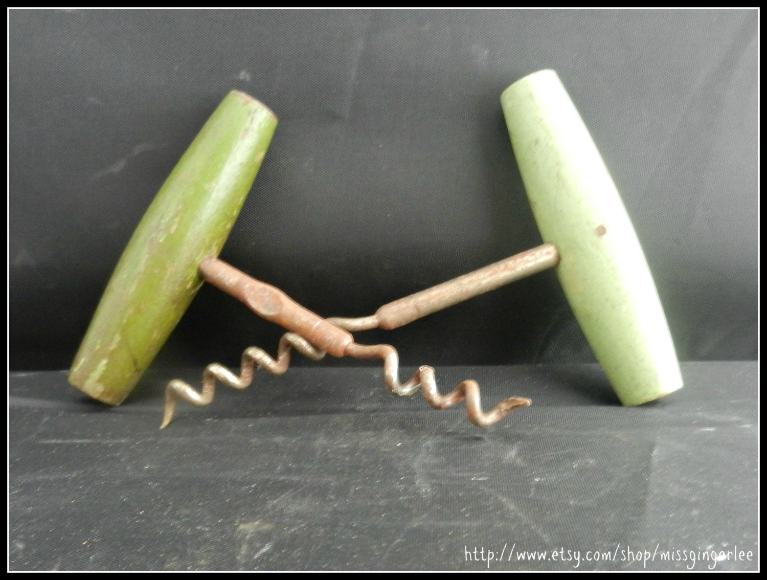Pair of vintage primitive corkscrews with green wooden handles kitchen tools