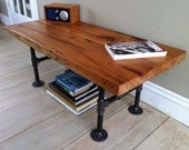 Reclaimed barnwood coffee table, 18" x 40", modern industrial style. Featuring antique sycamore wood with steel pipe legs.