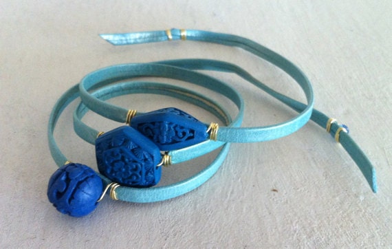 Cinnabar Wrap Bracelet: Triple Wrap in Pale Blue Leather with 3 Cyan Blue Carved Beads