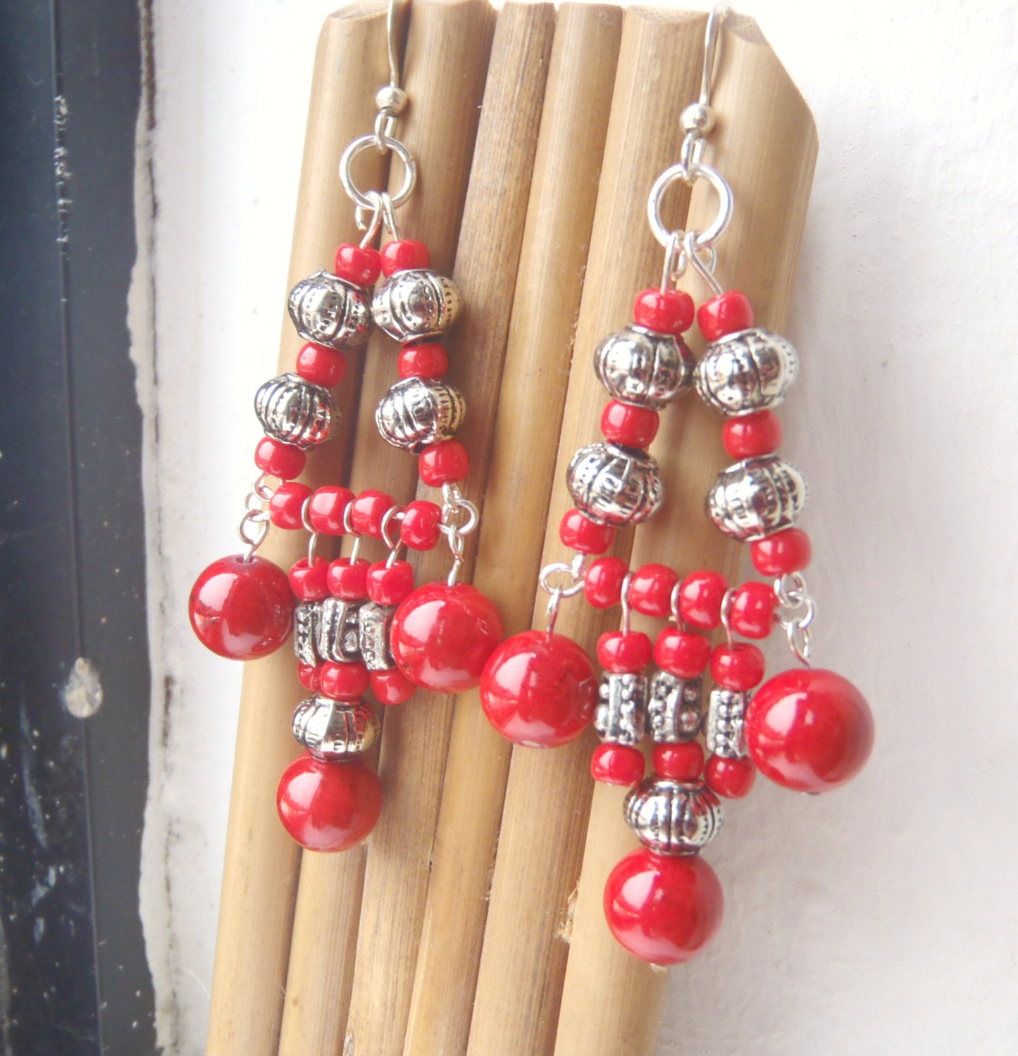 ethnic chandelier earrings made with tomato red prayer beads