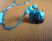 beaded bookmark, green and turquoise with elephant charm