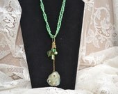 Green Necklace with Sea Glass, wire-wrapped pendant & cluster of crystal dangles.