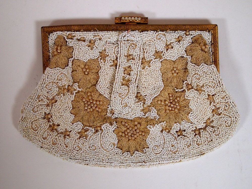 Vintage 1920s beaded clutch bag in white and beige bead and floral embroidery with decorative gold hardware and pearl coloured details