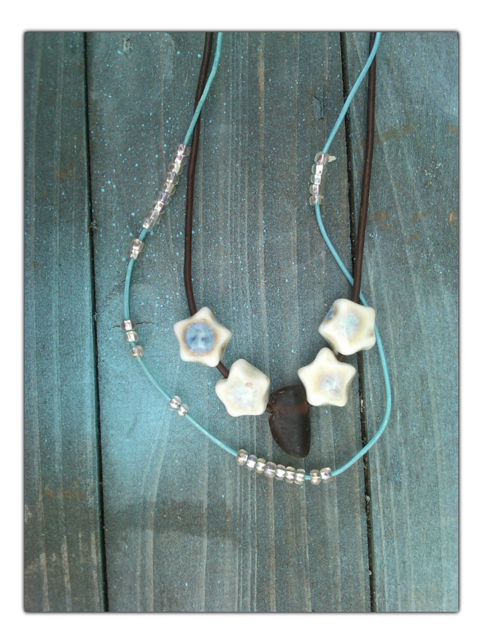 Star dancer necklace-star beads accented with amber beach glass