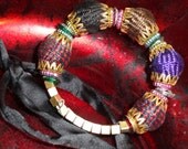 Handmade bracelet.  Wood, fibre beads brass wristwear. Ethnic adjustable bangle. Multi color cloth bead bracelet. From Artikrti.