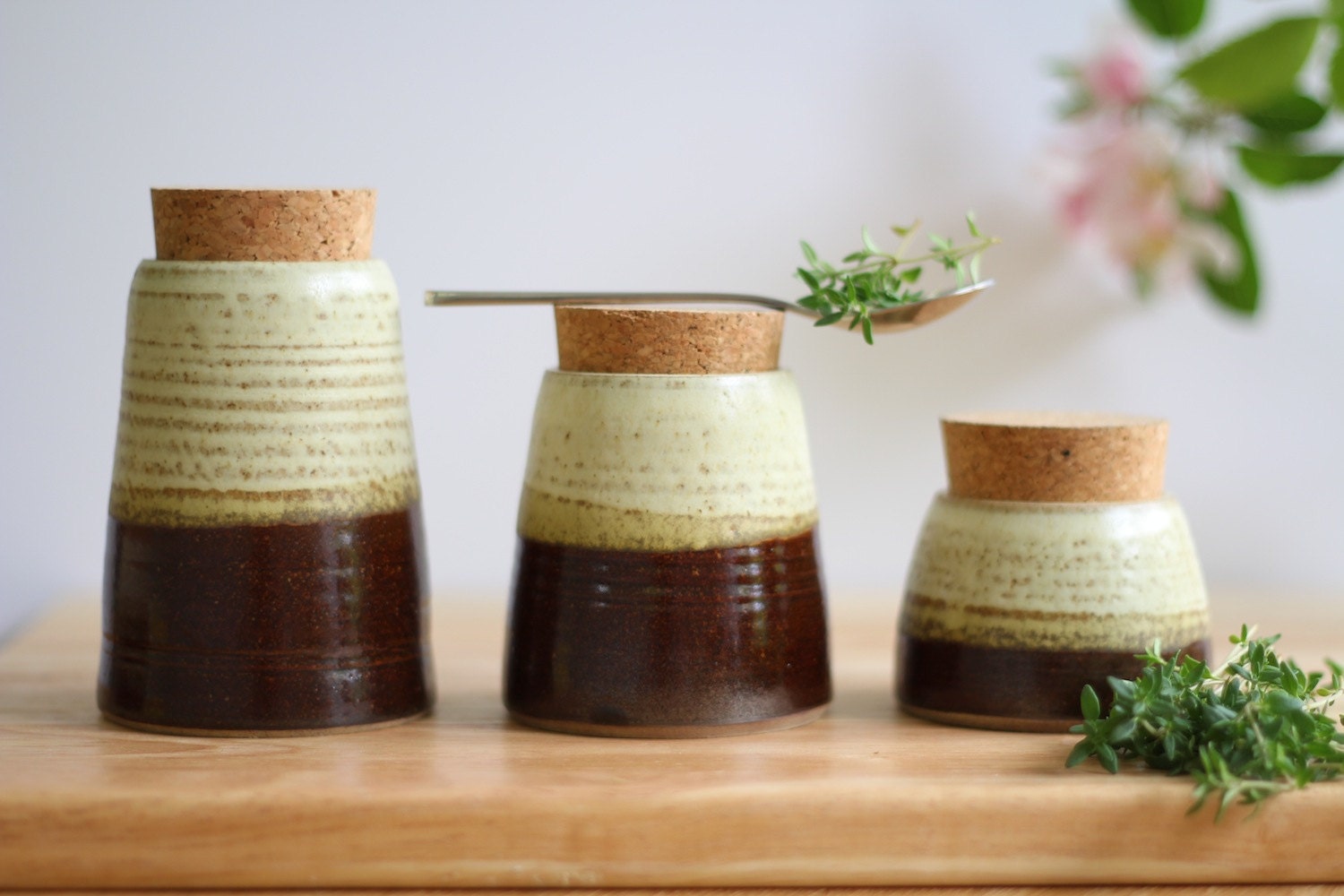 set of 3 of chocolate and oatmeal glazed Herb or Spice Jars.  Wheel thrown Stoneware clay with natural cork stoppers.
