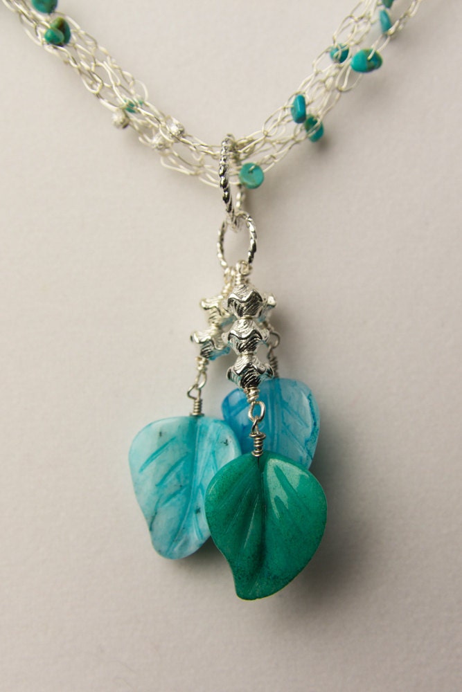 Hand crocheted, four strand silver plated necklace with Nevada turquoise and Serpentine carved leaves.