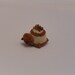 A miniature crocheted beaded turtle, a crochet miniature tortoise