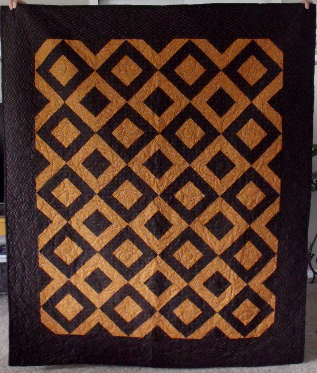 Geometric Patterned Quilt in Black and Burnt Orange.  Very Stunning.