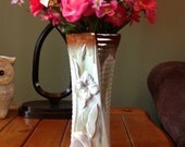 Beautiful vase with pink roses, pink and white tendrils
