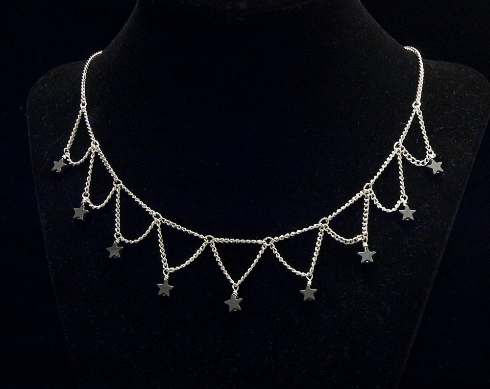 contrasting hematite stars with bright silver toned chain short necklace
