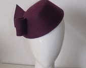 Wine in Berkeley Square.  Dark wine purple / aubergine wool felt 1940s pillbox cocktail hat with military style.  Fits all sizes.