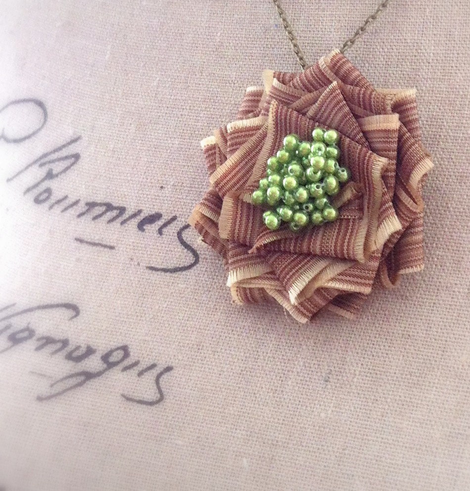 Irene Brooch Pendant Necklace. Tan stripe and lime green beaded fabric flower pin on long chain handmade by Cardinal House in Atlanta.