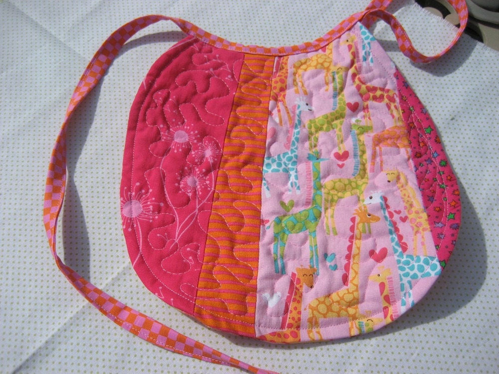 Quilted bib, reversible designer baby bib with bright colored giraffes