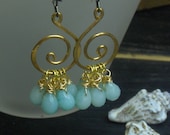 THE TUMULTUOUS SEA. Goledn brass spiral elements and sea blue faceted aquamarine briolette earrings. ooak
