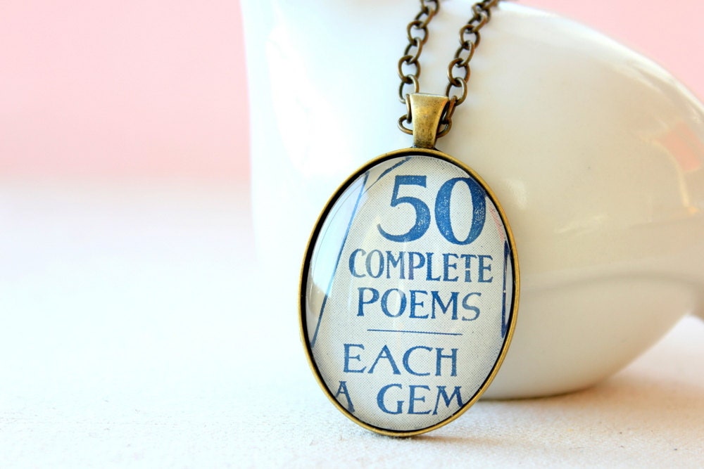 Poetry necklace in blue and white made from vintage sheet music advertisement.   Unique one of a kind accessory