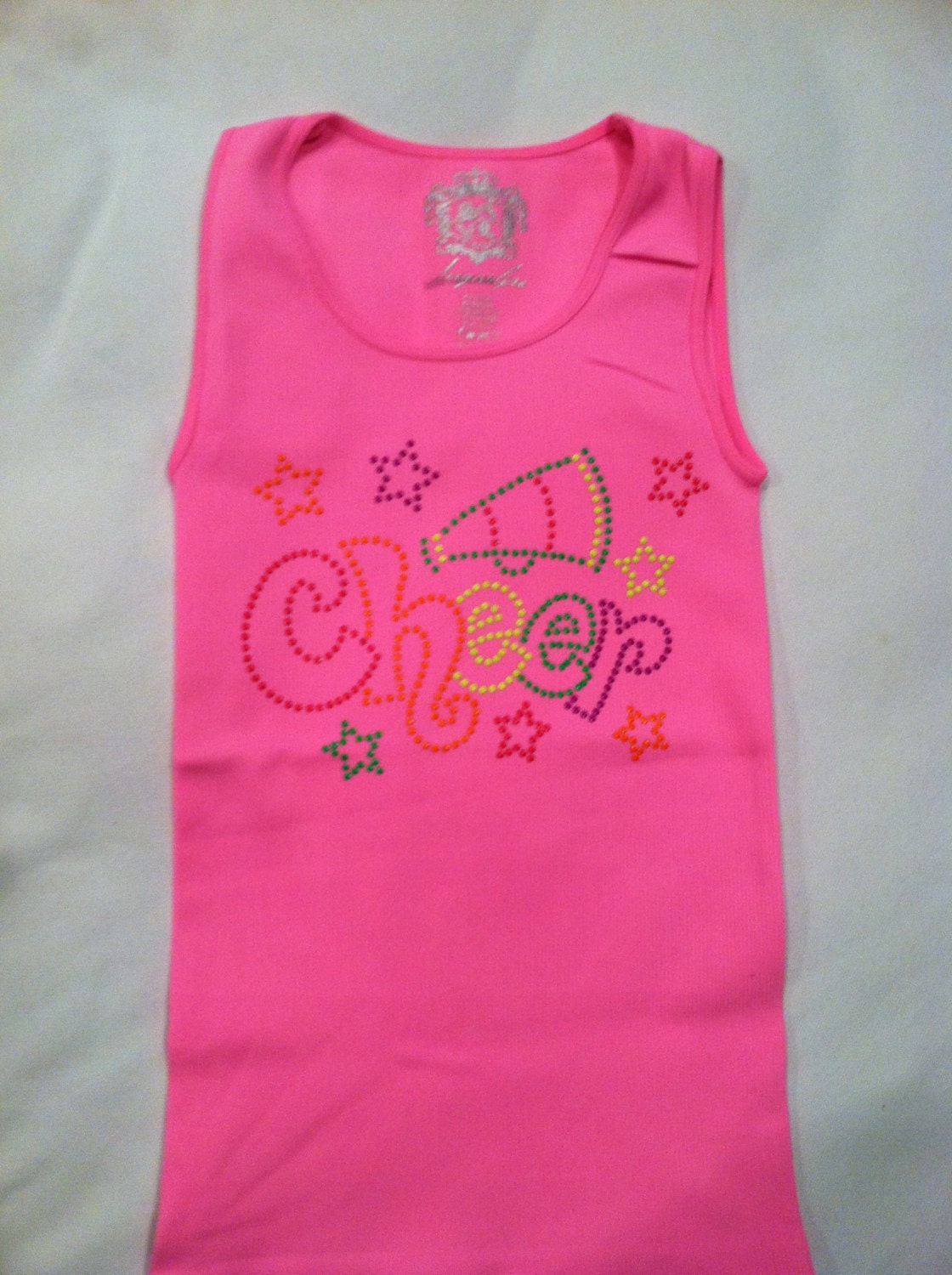 Neon pink tank with neon colored nailheads in cheer, dance or softball.